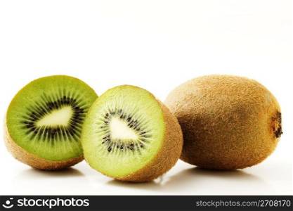 kiwi and two half. one kiwifruit and two half kiwis isolated on white background