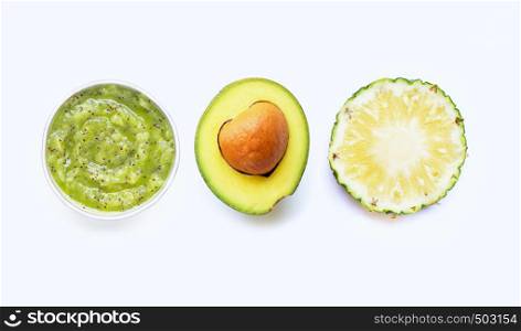 Kiwi, avocado and pineapple. Fresh fruits and natural ingredients for homemade skin care and scrub on white background.