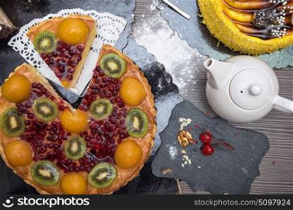 Kiwi fruit cake with tea. Kiwi fruit cake with tea on the table