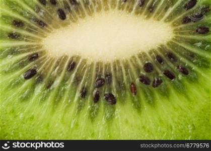 Kiwi fruit close up background. Cut kiwi fruit.