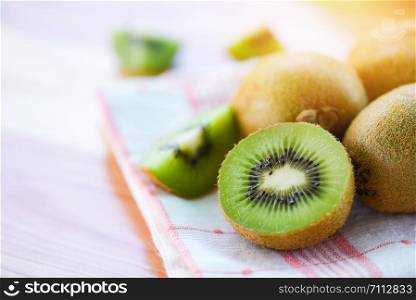 Kiwi slice on the table with kiwi fruit background