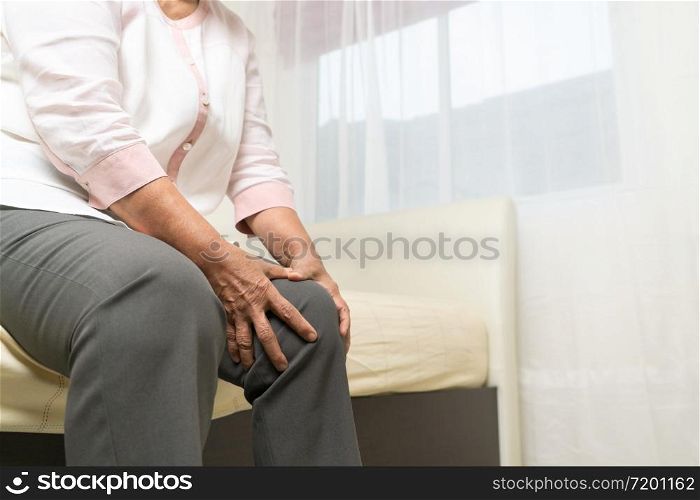 Knee pain of old woman at home, healthcare problem of senior concept