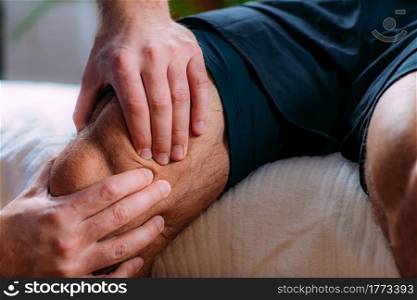 Knee sports massage physical therapy. Physiotherapist massaging injured knee. Sports injury treatment.. Knee Sports Massage Physical Therapy