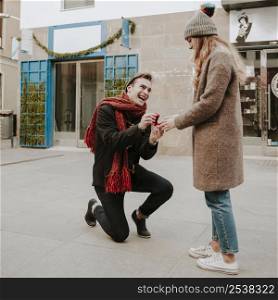 kneeled man making proposal