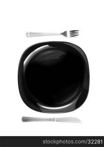 Knife and fork at black plate isolated on white background. Knife and fork at black plate