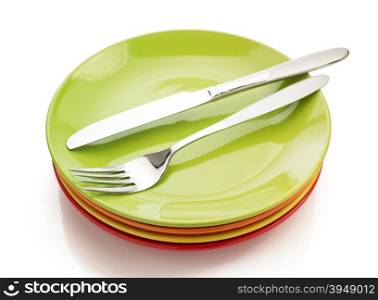 knife and fork at plate isolated on white background