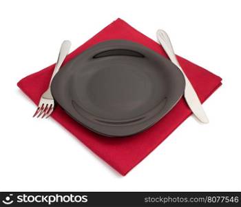knife and fork at plate on white background