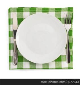 knife and fork at plate on white background