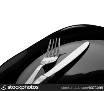 Knife and fork at plate on white background. With clipping path