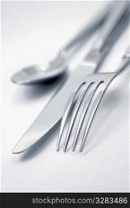Knife, fork, and spoon.