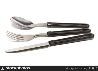 Knife, fork and spoon on a white background