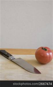 knife next to a vegetable