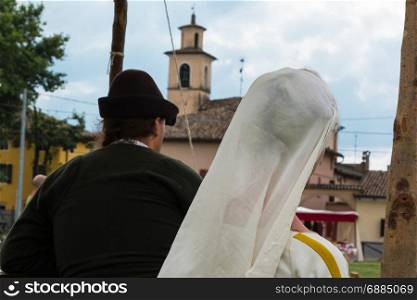 Knight and Dame with White Veil Outdoor Near Bell Tower: Medieval Event Reconstruction