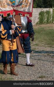 Knight and Squire with City Standard during Parade in Historical Event Reconstruction