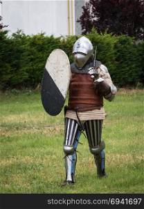 Knight in Battle with Silver Helmet, Armor, Shield and Sword. Knight in Battle with Silver Helmet, Armor, Shield and Sword.