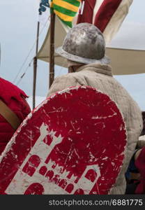 Knight with Helmet and Shield seated on a Chair: Medieval Event Reconstruction