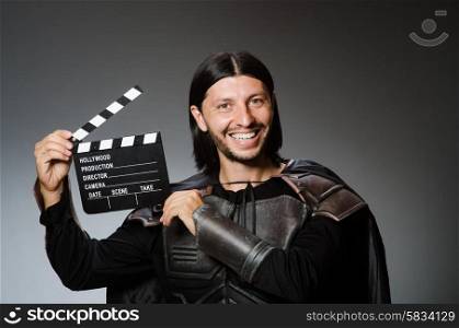 Knight with the movie board clapperboard
