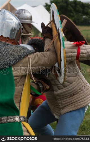 Knights in Battle with Silver Helmets and Shields: Medieval Event Reconstruction