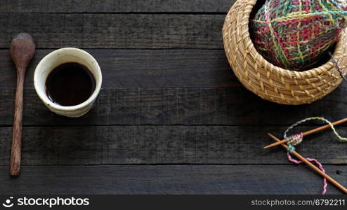 Knitted background with knitting needle, yarn and coffee cup, knit is hobby, leisure activities of many people in free time, also make many handmade product