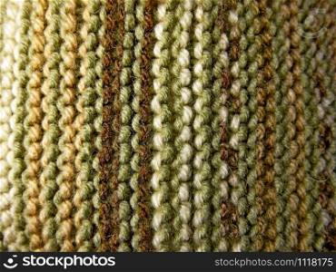 Knitted fabric texture. Background image. Hobbies, leisure, crafts. Vertical arrangement of the pattern. Knitting. Knitted fabric. Knitting texture. Background image. Hobbies leisure crafts.