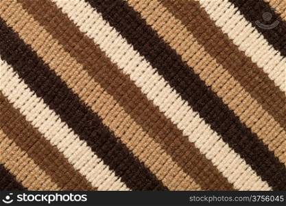 Knitted fabric texture for background. Brown stripes, closeup