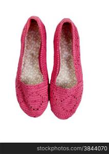Knitted pink shoes isolated on white.