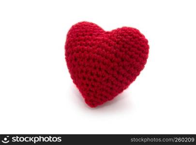Knitted red heart isolated on a white background