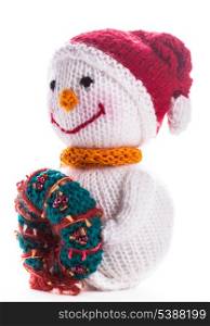 Knitted snowman with christmas wreath isolated on white