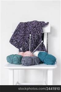 knitting needles wool chair