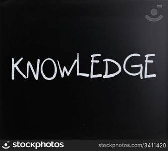 ""Knowledge" handwritten with white chalk on a blackboard"