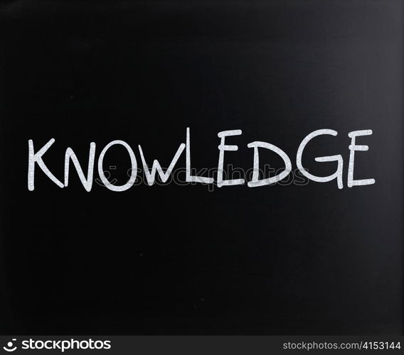 ""Knowledge" handwritten with white chalk on a blackboard"