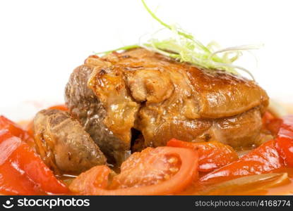 knuckle of veal baked with vegetables closeup