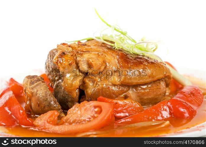 knuckle of veal baked with vegetables closeup