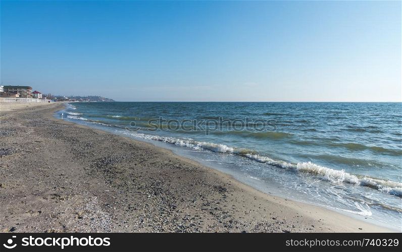 Koblevo, Ukraine - 10.11. 2019. Deserted autumn beach at the Black Sea resort in the village of Koblevo, Ukraine. Deserted beach in Koblevo, Ukraine