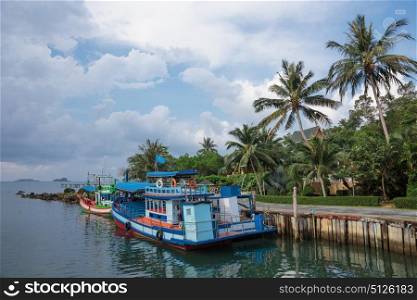 KOH CHANG, THAILAND - 1 APRIL, 2015: Tourist ship at the pier in the bay