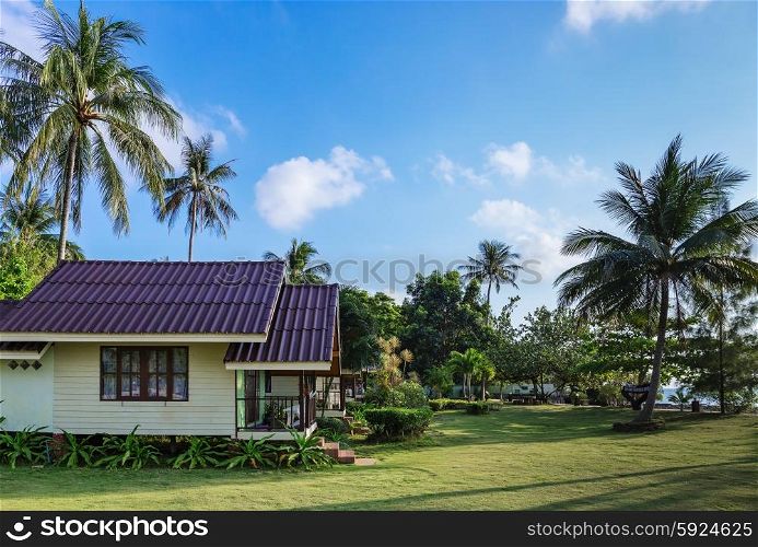 KOH CHANG, THAILAND - APRIL 2, 2015: Bailan Beach Resort. Cottages on the green lawn in a tropical garden