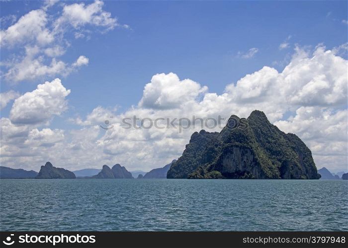 Koh Phanak with other islands in the background in Phang Nga Bay, Thailand