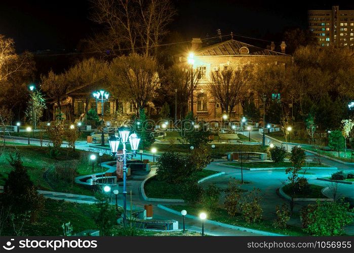 Komsomolskaya square of Khabarovsk at night by the light of lanterns.. Khabarovsk, Russia - Oct 24, 2019: Komsomolskaya square of Khabarovsk at night by the light of lanterns.