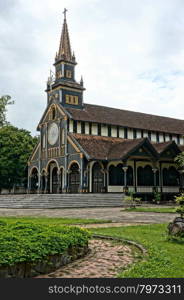 KON TUM, VIET NAM- AUG 22: Kontum wooden church, 100 years old, an ancient cathedral, religion heritage, famous place for travel, amazing architect make wonderful landscape, Vietnam, Aug 22, 2015