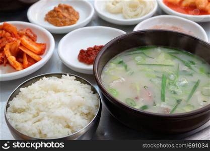 Korean food Dwaeji-gukbap. Rice and pork soup in a steaming stone bowl.