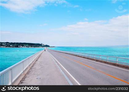Kouri bridge cross over beautiful turqouise blue sea to Kouri island, Naha, Okinawa, Japan