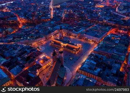 Krakow downtown aerial drone view main square at dusk, Poland Europe