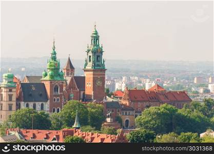 Krakow, Poland - August 11, 2017: View of the medieval Wawel Cas. Wawel Castle is located on a hill at an altitude of 228 meters on the bank of the Vistula River in Krakow. From the 11th to the beginning of the 17th century, the Wawel Castle was the residence of Polish kings and was the center of the country&rsquo;s spiritual and political power.