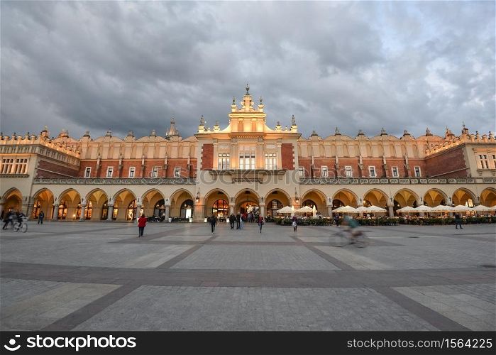 Krakow, Poland - May 20, 2020: View on Cloth hall in main market square of Krakow and dramatic sky, Poland. View on Cloth hall in main market square of Krakow and dramatic sky, Poland