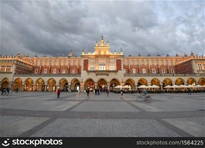 Krakow, Poland - May 20, 2020: View on Cloth hall in main market square of Krakow and dramatic sky, Poland. View on Cloth hall in main market square of Krakow and dramatic sky, Poland