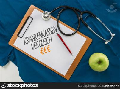 Krankenkassen Vergleich (in german Health insurance comparison) Clipboard with stethoscope.. Krankenkassen Vergleich (in german Health insurance comparison) Clipboard with stethoscope
