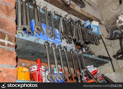 Krasnodar, Russia - October 18, 2017: Wrenches and other tools in the car garage.. Wrenches and other tools in the car garage.