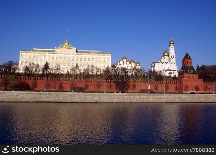 Kremlin red walls and towers on the river, Moscow, Russia