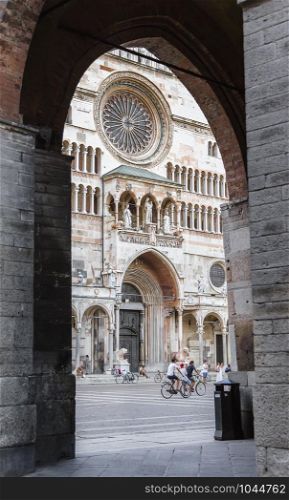 KREMONA-, ITALY - 02 SEPTEMBER 2015: View of the Cathedral of the city of Cremona through the arch of the commune. Cremona. Italy