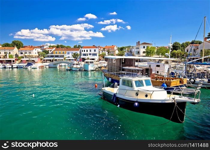 Krk island. Town of Njivice turquoise harbor and waterfront view, Krk island in Croatia